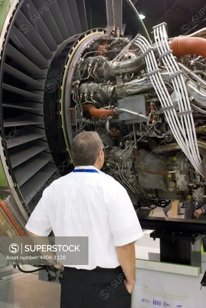 Man looking at aircraft engine