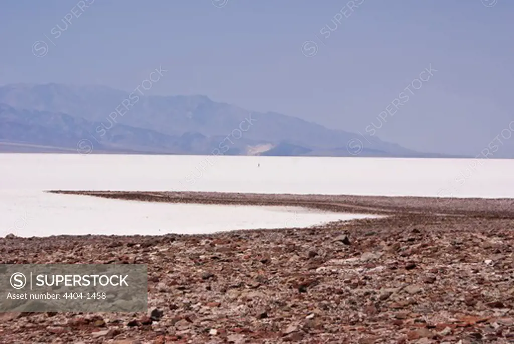 USA, California, Death Valley, Lonely figure on salt flats
