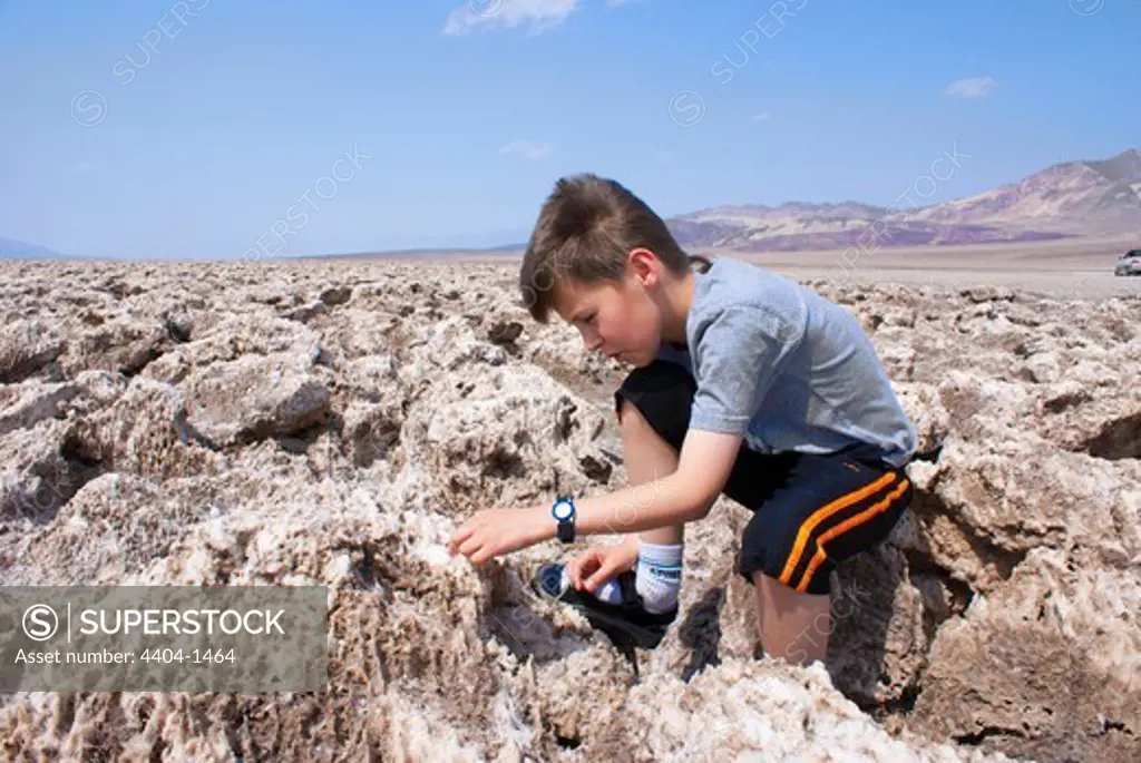 USA, California, Death Valley, Young geologist on Devil's Golfcourse
