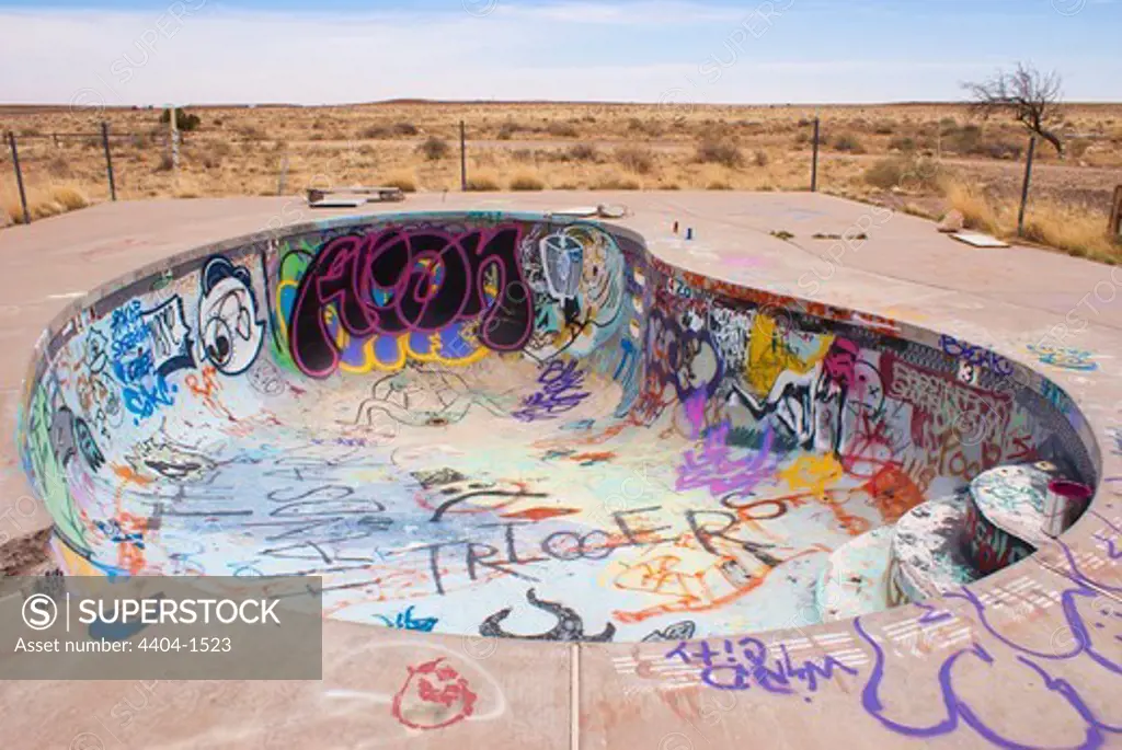 USA, Arizona, Graffiti in abandoned swimming pool at Two Guns ghost town