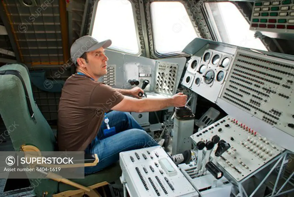 Man at controls of Russian space shuttle Buran at a museum, Baikonur Space Museum, Baikonur Cosmodrome, Kazakhstan