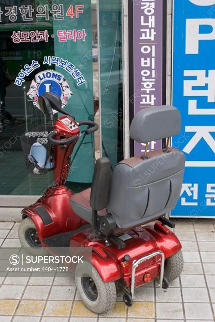South Korea, Daejeon, Mobility scooter on street