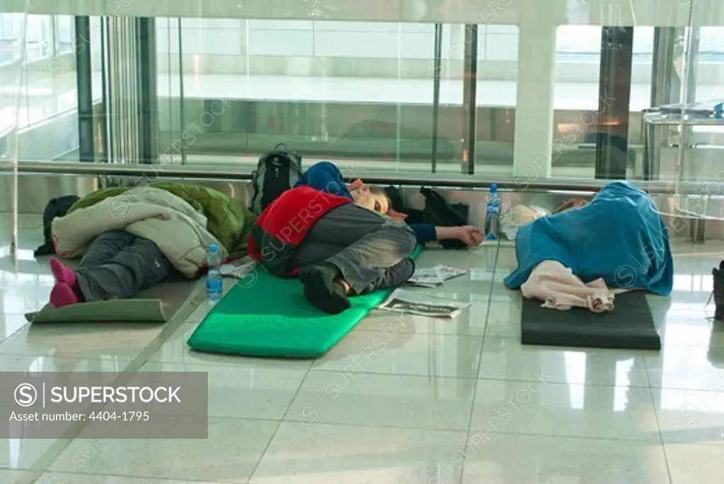 Passengers asleep on floor at Dubai airport