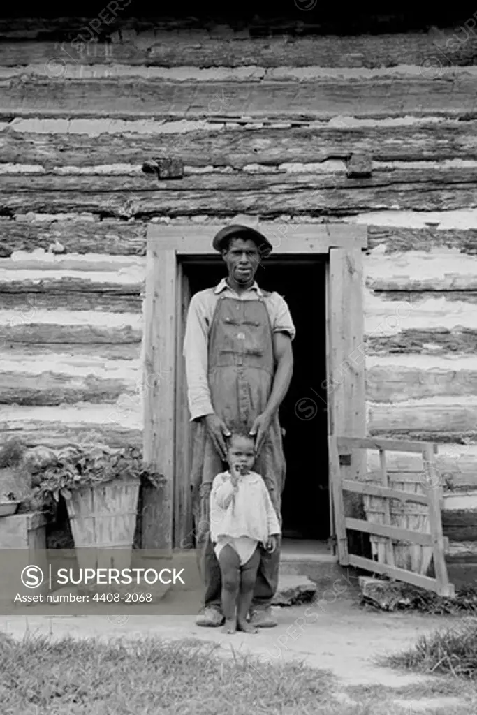 Young sharecropper and his first child, Dorothea Lange