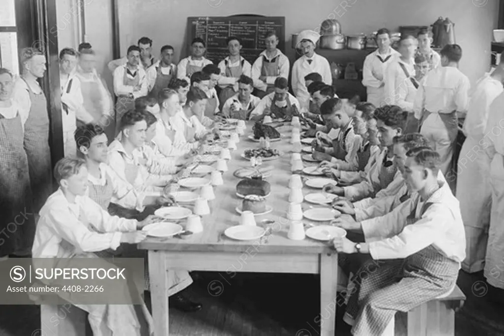 Naval Cadets sit at long table with bowls in front, Classic Photography