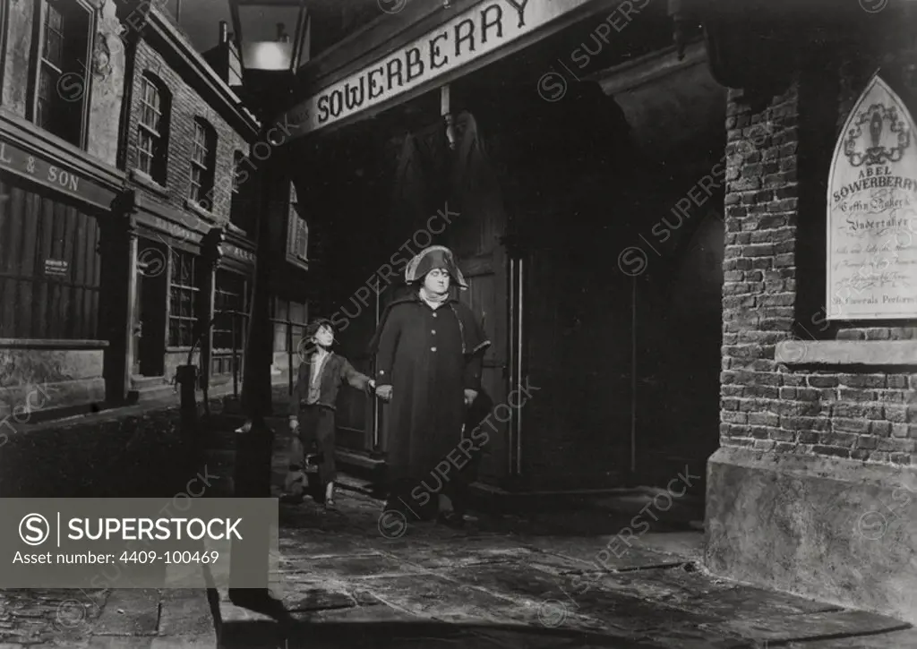 FRANCIS L. SULLIVAN and JOHN HOWARD DAVIES in OLIVER TWIST (1948), directed by DAVID LEAN.