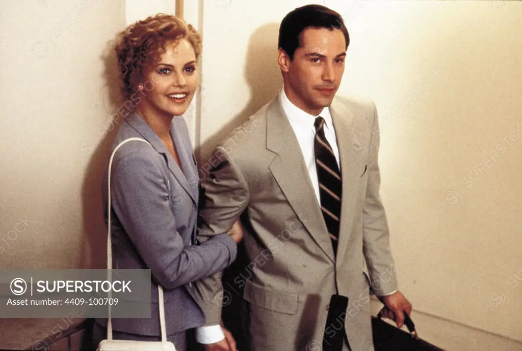 CHARLIZE THERON and KEANU REEVES in THE DEVIL'S ADVOCATE (1997), directed by TAYLOR HACKFORD.