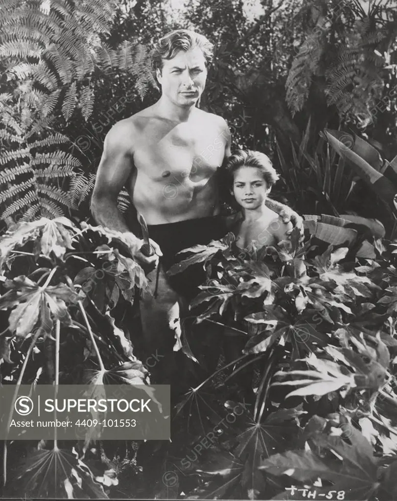 LEX BARKER and TOMMY CARLTON in TARZAN'S SAVAGE FURY (1952), directed by CY ENDFIELD.