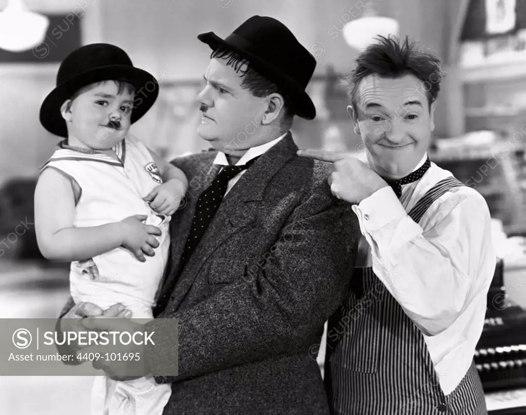 OLIVER HARDY, STAN LAUREL and SPANKY in TIT FOR TAT (1935), directed by CHARLEY ROGERS.