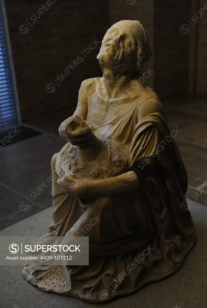 Drunken old woman. Roman sculpture after original of about 200 BC. The woman clasps a wine jug. Glyptothek. Munich. Germany.