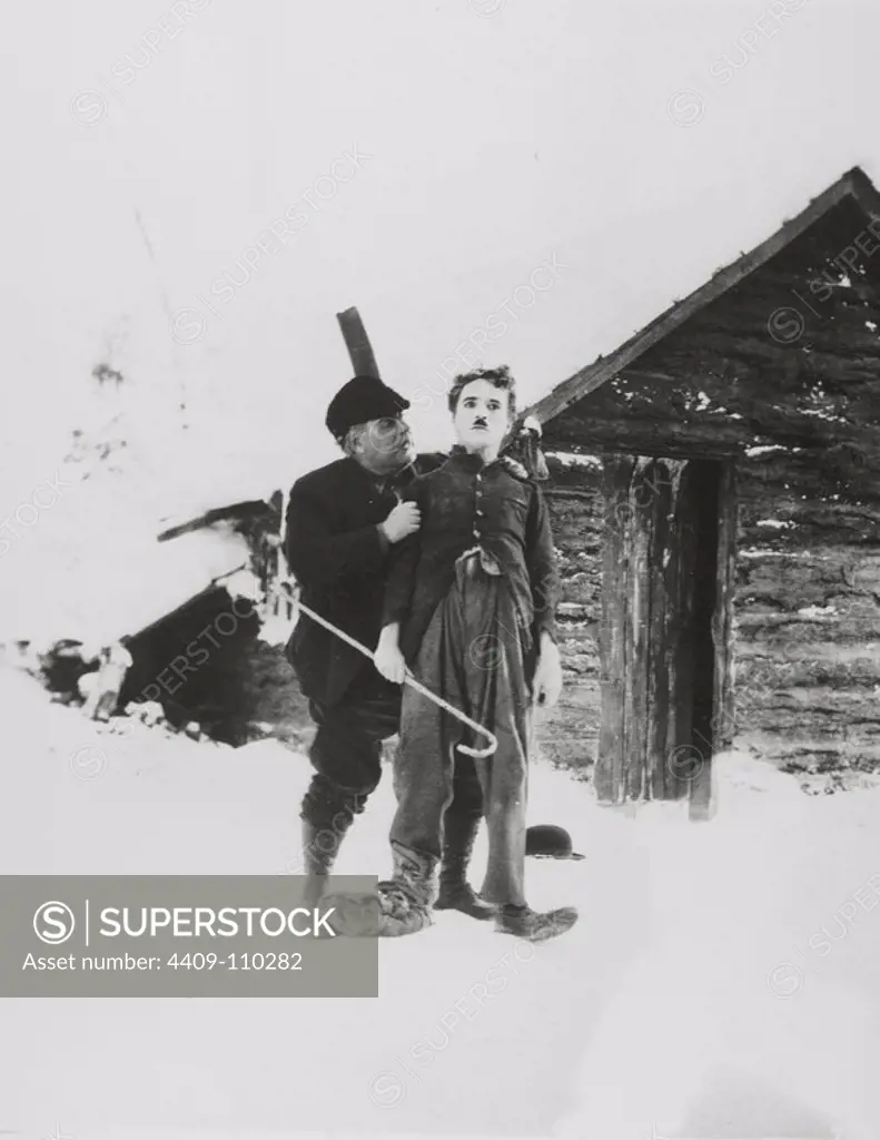CHARLIE CHAPLIN and HENRY BERGMAN in THE GOLD RUSH (1925), directed by CHARLIE CHAPLIN.