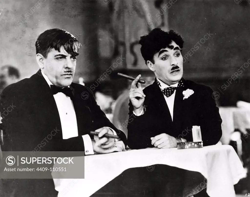 CHARLIE CHAPLIN and HARRY MYERS in CITY LIGHTS (1931), directed by CHARLIE CHAPLIN.