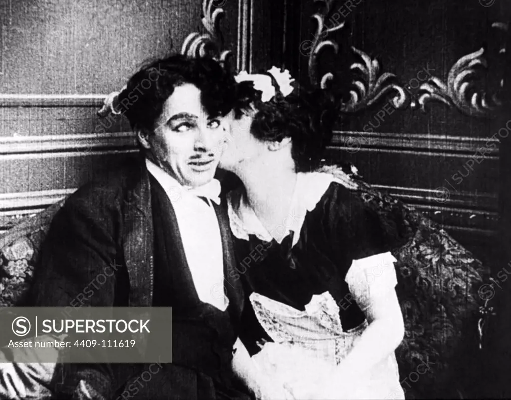 CHARLIE CHAPLIN in TILLIE'S PUNCTURED ROMANCE (1914), directed by MACK SENNETT.