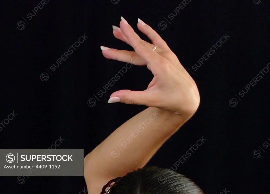 Photo detail of a flamenco dancer hand.