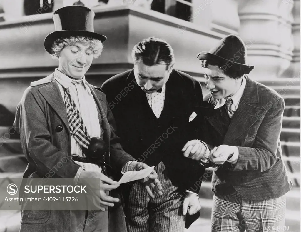 HARPO MARX, THE MARX BROTHERS and CHICO MARX in ANIMAL CRACKERS (1930), directed by VICTOR HEERMAN.