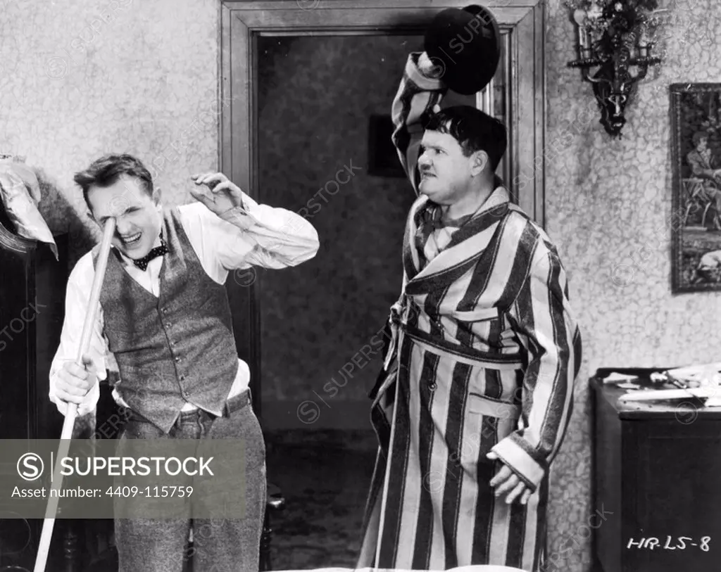 OLIVER HARDY and STAN LAUREL in HELPMATES (1932), directed by JAMES PARROTT.