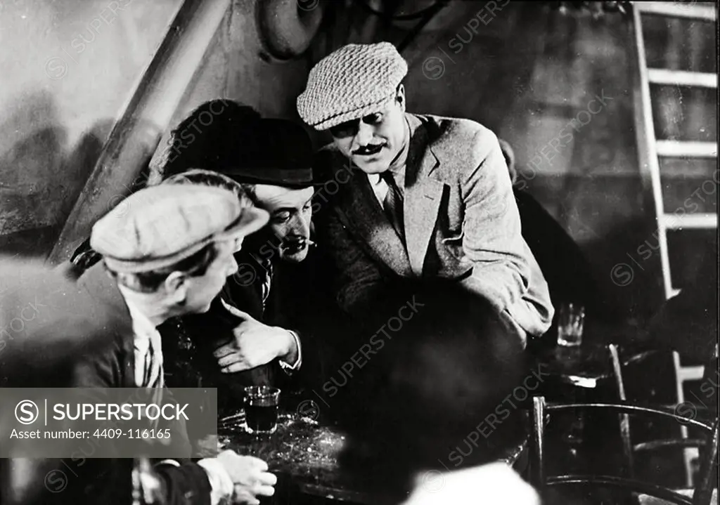 GASTON MODOT in UNDER THE ROOFS OF PARIS (1930) -Original title: SOUS LES TOITS DE PARIS-, directed by RENE CLAIR.