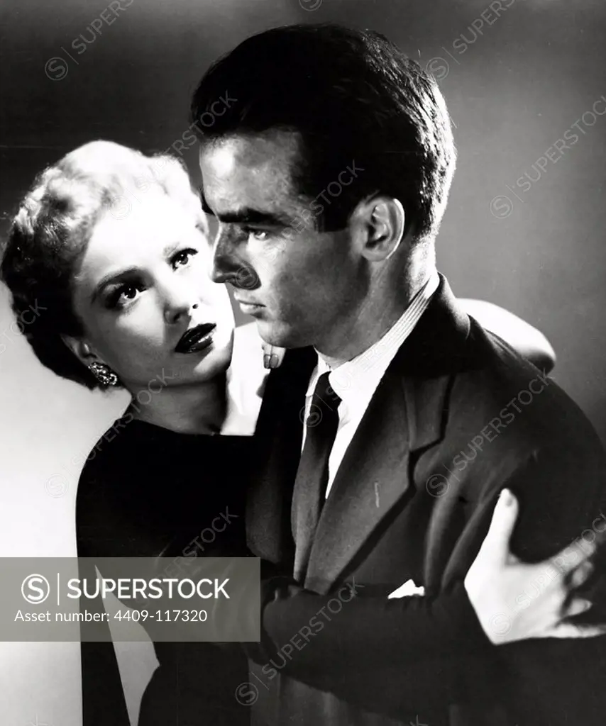 ANNE BAXTER and MONTGOMERY CLIFT in I CONFESS (1953), directed by ALFRED HITCHCOCK.