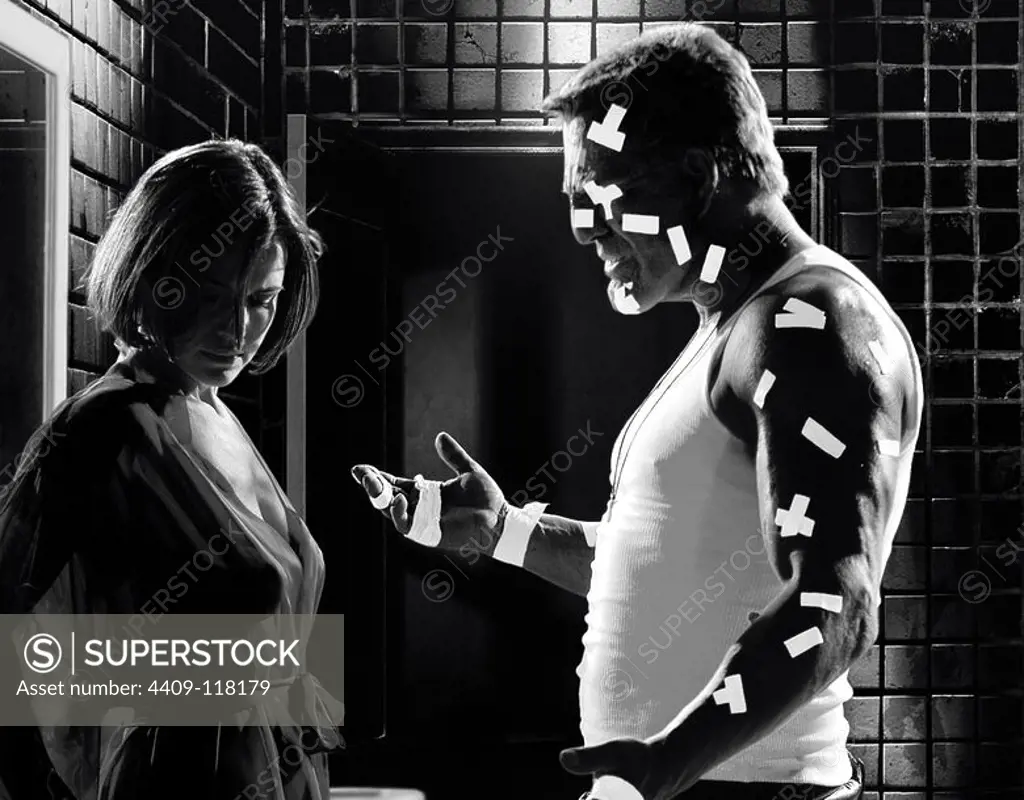MICKEY ROURKE and CARLA GUGINO in SIN CITY (2005), directed by ROBERT RODRIGUEZ and FRANK MILLER.