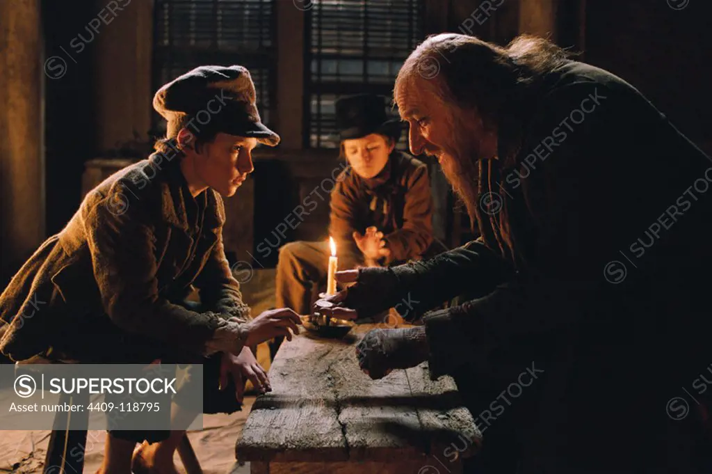 BEN KINGSLEY and BARNEY CLARK in OLIVER TWIST (2005), directed by ROMAN POLANSKI. Copyright: Editorial use only. No merchandising or book covers. This is a publicly distributed handout. Access rights only, no license of copyright provided. Only to be reproduced in conjunction with promotion of this film.