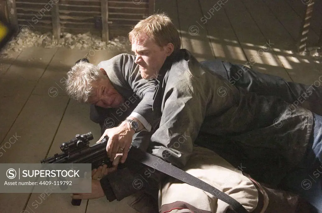 HARRISON FORD and PAUL BETTANY in FIREWALL (2006), directed by RICHARD LONCRAINE.