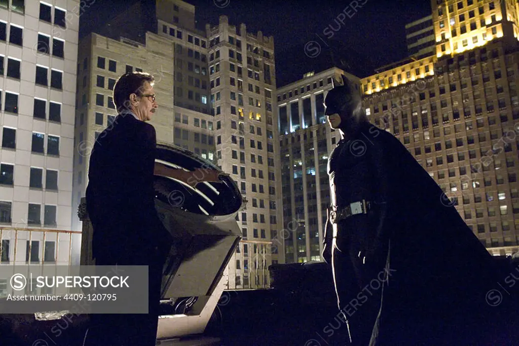 CHRISTIAN BALE and GARY OLDMAN in BATMAN BEGINS (2005), directed by CHRISTOPHER NOLAN.