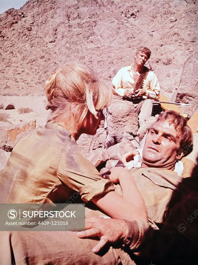 STANLEY BAKER and SUSANNAH YORK in SANDS OF THE KALAHARI (1965), directed by CY ENDFIELD.