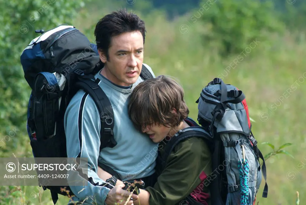 JOHN CUSACK and JAMIE ANDERSON in THE CONTRACT (2006), directed by BRUCE BERESFORD. Copyright: Editorial use only. No merchandising or book covers. This is a publicly distributed handout. Access rights only, no license of copyright provided. Only to be reproduced in conjunction with promotion of this film.