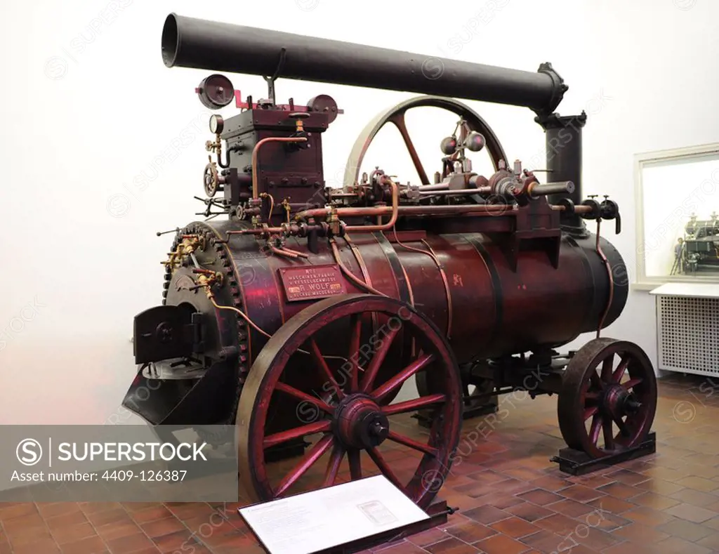 Travelling Steam Lokomobile Maschinenfabrik Rudolf Wolf, Magdeburg-Buckau, 1862. This first locomobile of the Wolf company was used to drive threshing machines. It was in use from 1862 to 1887 on a farm near Strassfurt. Horses drew the machine to its particular place of use. Mounted at the front on the flywheel shaft was a belt pulley from which the drive force was taken. Deutches Museum. Munich. Germany.