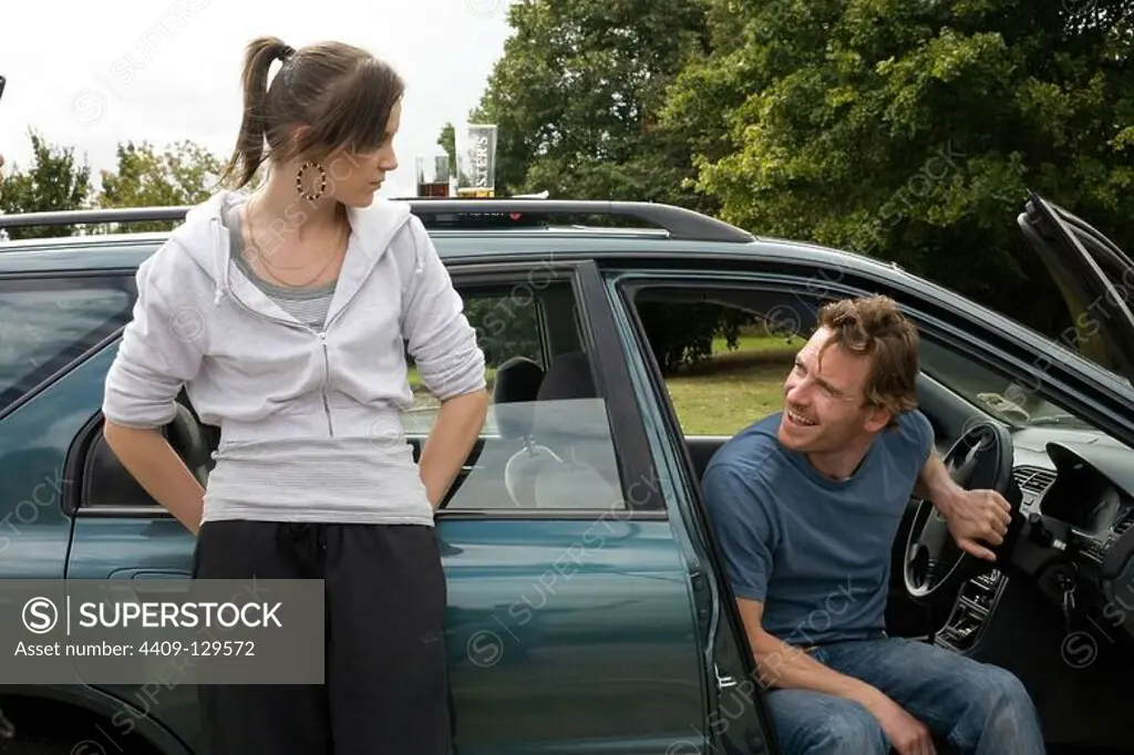 MICHAEL FASSBENDER and KATIE JARVIS in FISH TANK (2009), directed by ANDREA ARNOLD.