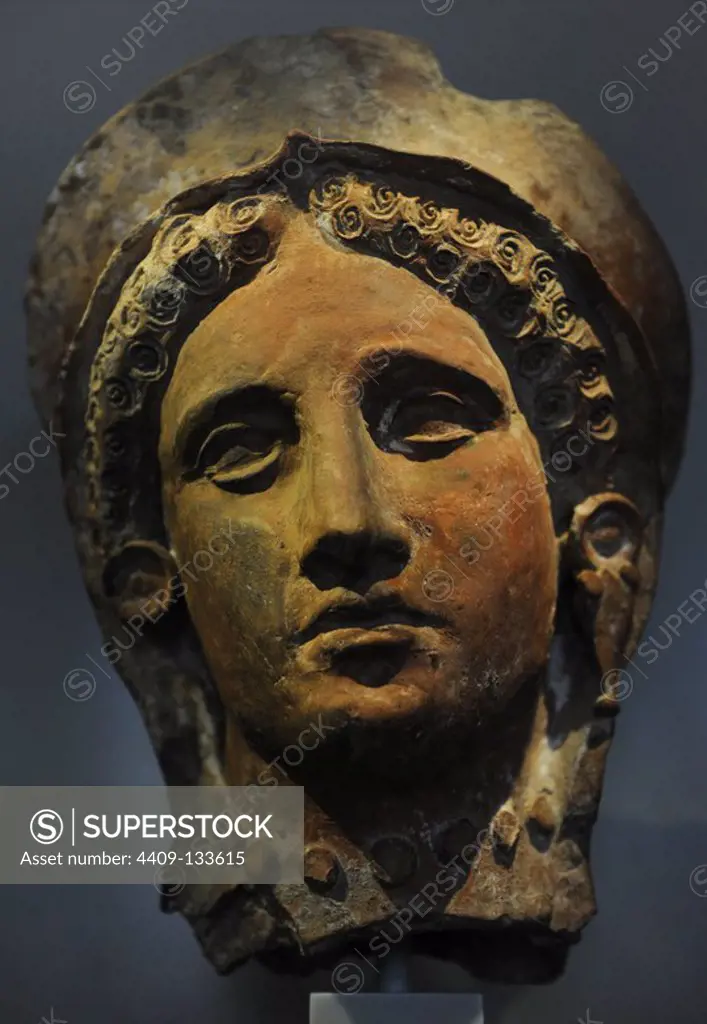 Female head with veil and diadem. 4th century BC. Terracotta. From area of Paphos, Cyprus. Neues Museum. Berlin. Germany.