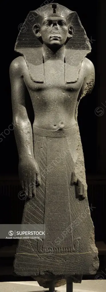 Praying statue of king Amenemhet III or Amenemhat III. King of ancient Egypt, 12th Dynasty. Middle Kingdom. c.1840-1800 BC. Memphis. Dolorite. Neues Museum (New Museum). Berlin. Germany.