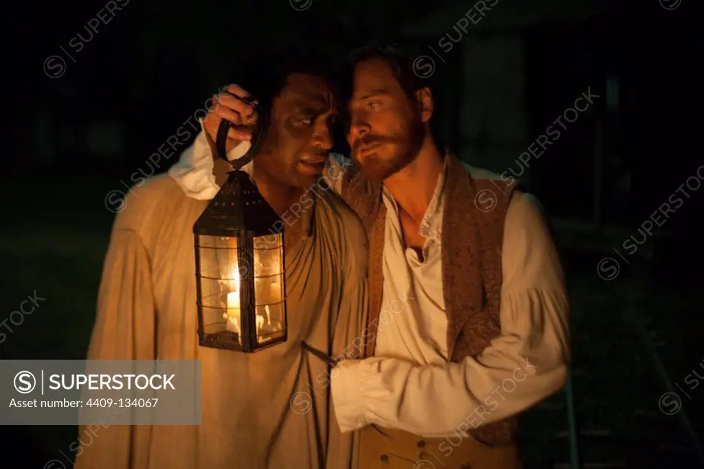 CHIWETEL EJIOFOR and MICHAEL FASSBENDER in 12 YEARS A SLAVE (2013), directed by STEVEN R. MCQUEEN.