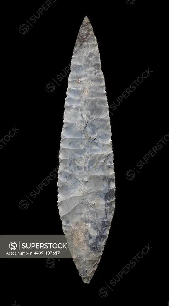 Piece from the exhibition "Art without artists". Large flint laurel-leaf point from Placard Cave, Vilhonneur, Carante (France). Solutrean period.
