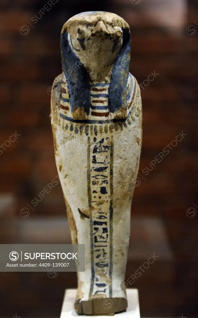 Qebehsenuef, son of Horus. Protective deity. Depicting as a human mummify body with falcon head. Wood. Late Period. 746-332 BC. Neues Museum. Berlin. Germany.