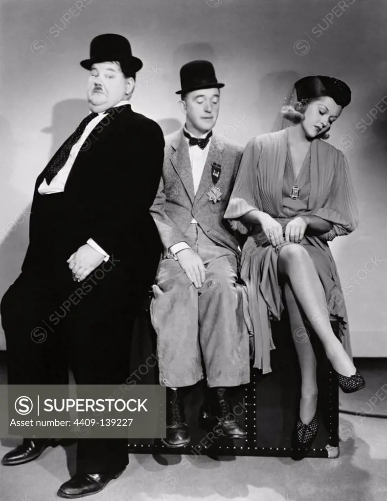 OLIVER HARDY, STAN LAUREL and PATRICIA ELLIS in BLOCK-HEADS (1938).