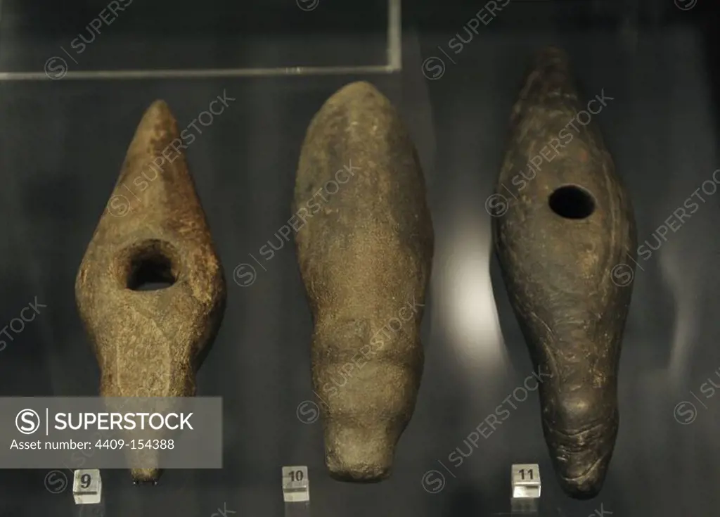 Prehistory. Northern Europe. Early Stone Age. Axes decorated with carved animal heads. Bear, elk, duck. The National Museum of Finland. Helsinki.
