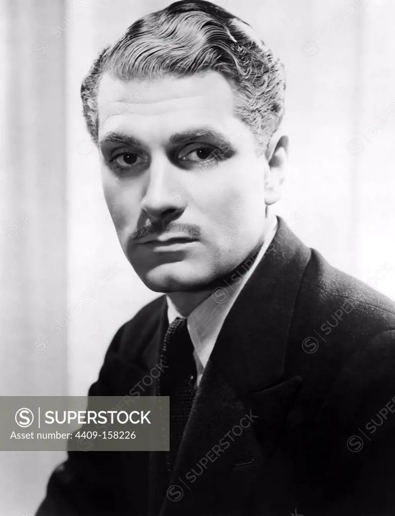 LAURENCE OLIVIER in REBECCA (1940), directed by ALFRED HITCHCOCK.