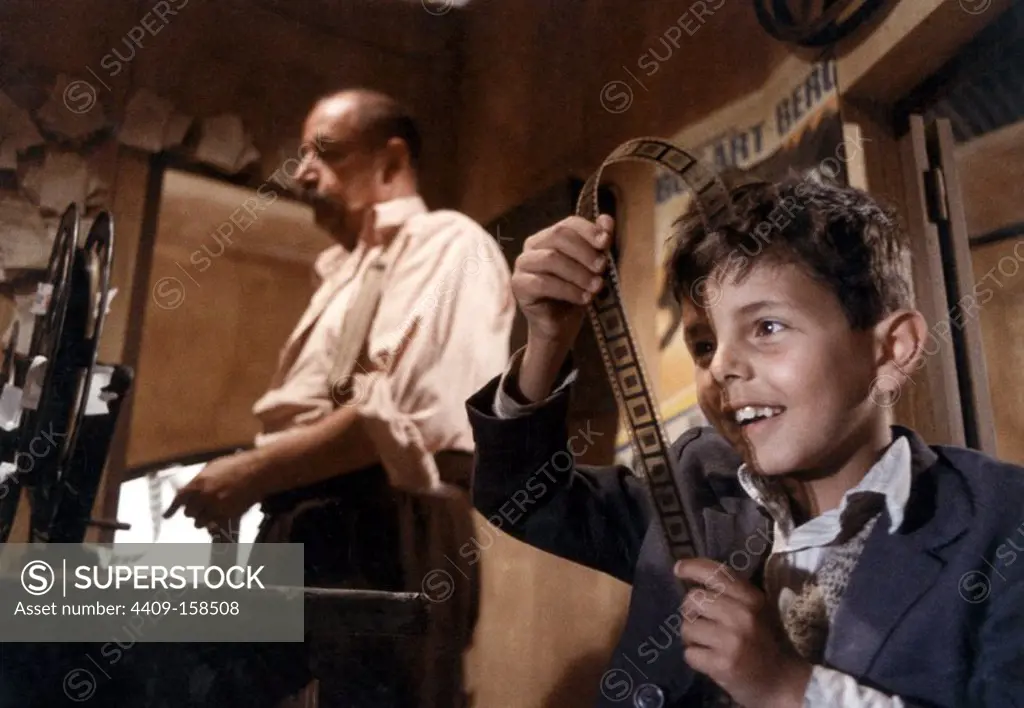 PHILIPPE NOIRET and SALVATORE CASCIO in CINEMA PARADISO (1988) -Original title: NUOVO CINEMA PARADISO-, directed by GIUSEPPE TORNATORE.