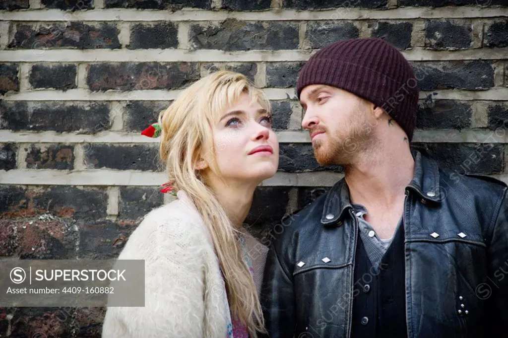 AARON PAUL and IMOGEN POOTS in A LONG WAY DOWN (2013), directed by PASCAL CHAUMEIL.