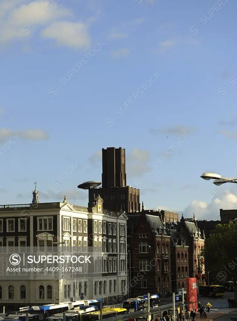 Netherlands. Utrecht. The Inktpot, big brick building and offices for ProRail, by architect George van Heukelom. The Ufo, by Marc Ruygrok, ,1999.