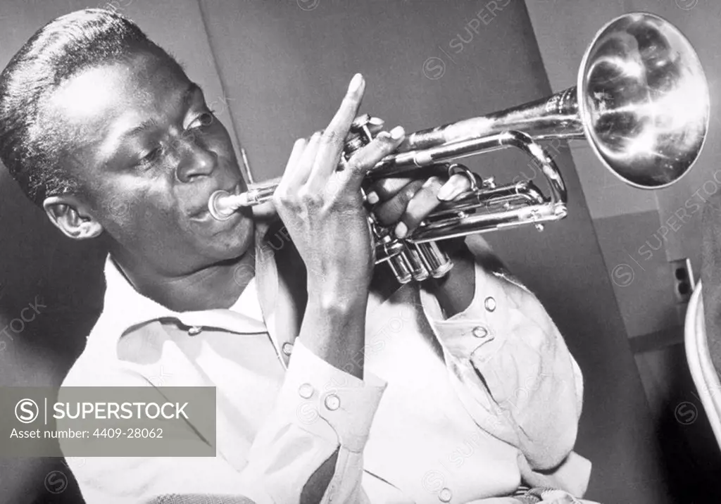 American jazz musician and composer Miles Davis playing the trumpet, 50s.