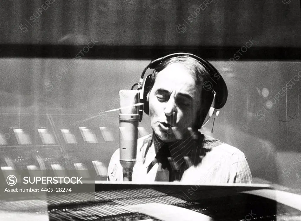 French singer Charles Aznavour perfoming in a recording studio. September 1974.