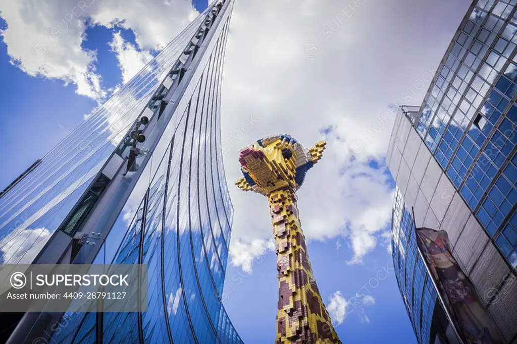 giant giraffe built with Lego pieces, Potsdamer Platz buildings, Berlin, germany, europe.