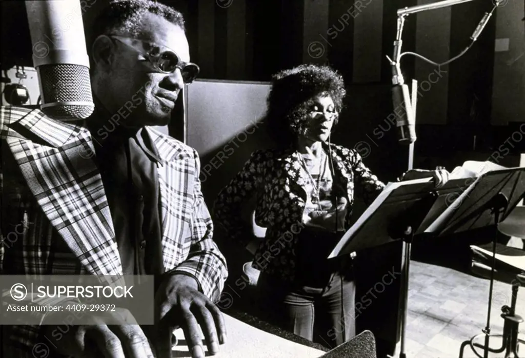 Ray Charles in Britain to record "Porggy & Bess" for RGA Records and reading special Braille score.