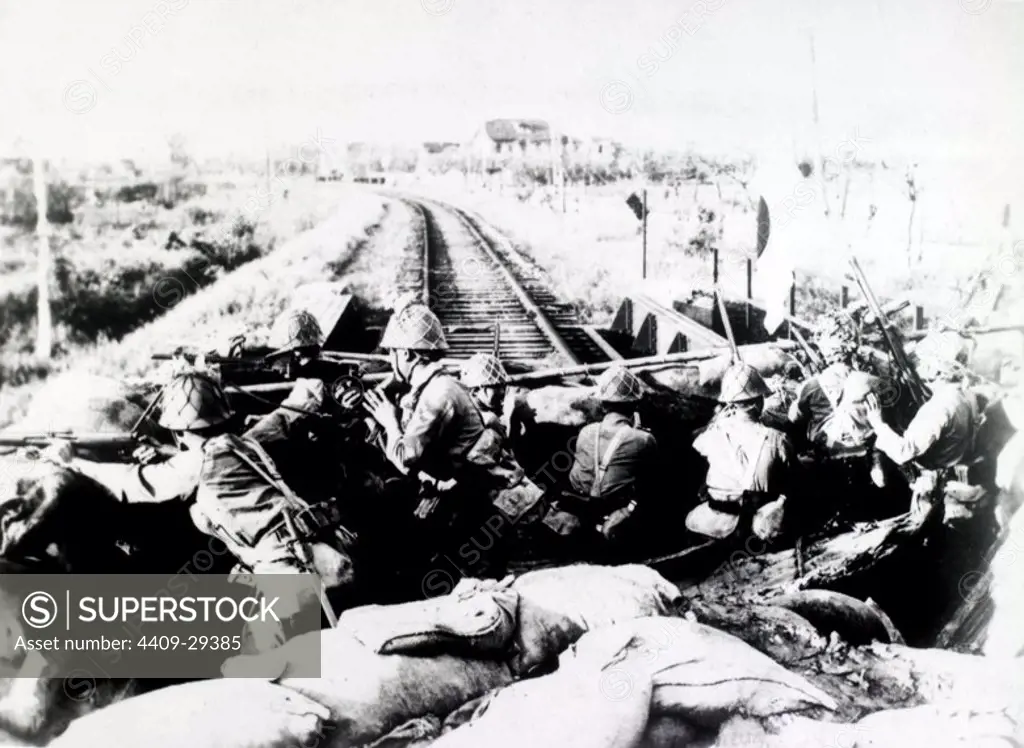 Kwantung army on the Transmanchurian railroad. Japanese troops of the Kwantung army on one of the open railroad cars travelling on the famed Russo-Chinese railroad.
