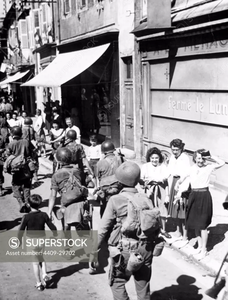 American troops of the 7th Army 45th Division as they march trhough their town on September 4, 1944.