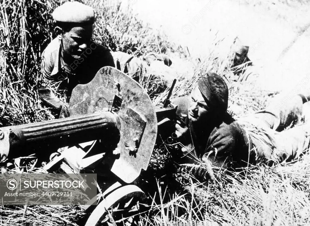 Spanish Civil War. International brigade using the "Tashanka", the WWI Russian machine gun.May 1938.