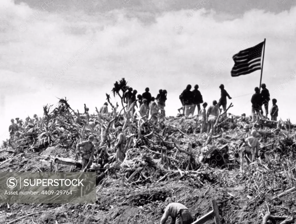 Marines plant the U.S. flag at mount Suribachi in the Iwo Jima island (Japan). Feb-March 1945.