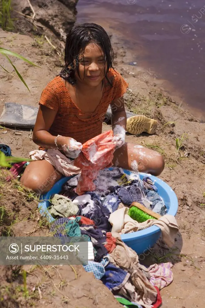 Girl washing clothes. Buenos Aires native community. Pacaya Samiria National Reserve. Amazon Basin. Loreto. Peru.